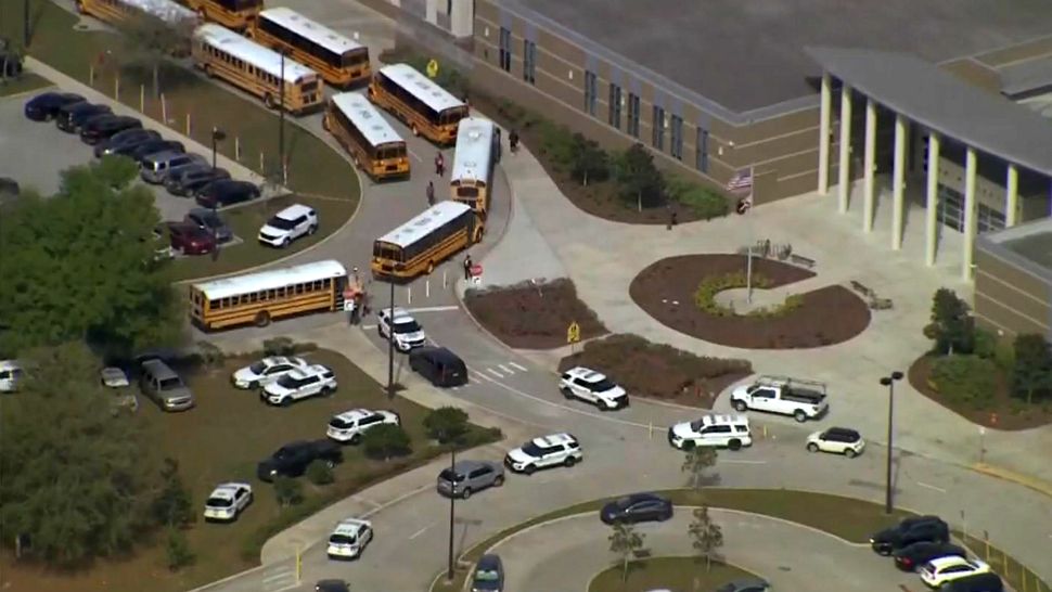 Orange County deputies respond to Wekiva High School in Apopka on Friday after an anonymous caller said 2 people were on their way to shoot up the school, authorities said. Investigators don't believe the threat was valid. (Sky 13)