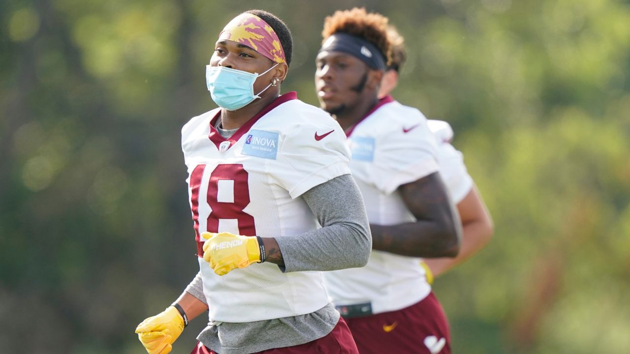 Washington Football Team wide receiver Isaiah Wright (18) wears a mask to protect against COVID-19 during practice at the team's NFL football training facility, Tuesday, Aug. 10, 2021, in Ashburn, Va. (AP Photo/Alex Brandon)
