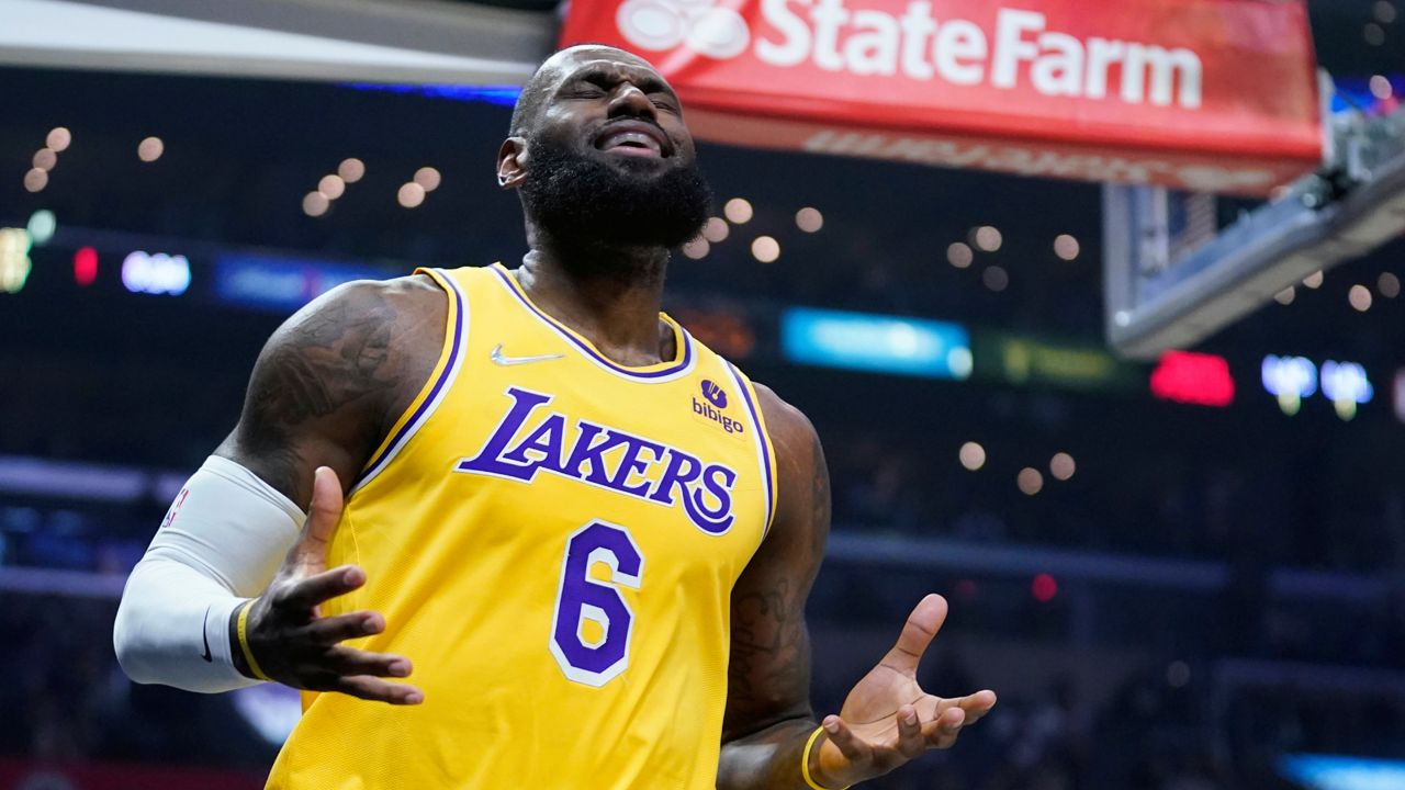 Los Angeles Lakers forward LeBron James (6) reacts after a foul was called against the Lakers during the first half of an NBA basketball game against the Los Angeles Clippers on Thursday, March 3, 2022, in Los Angeles. (AP Photo/Marcio Jose Sanchez)