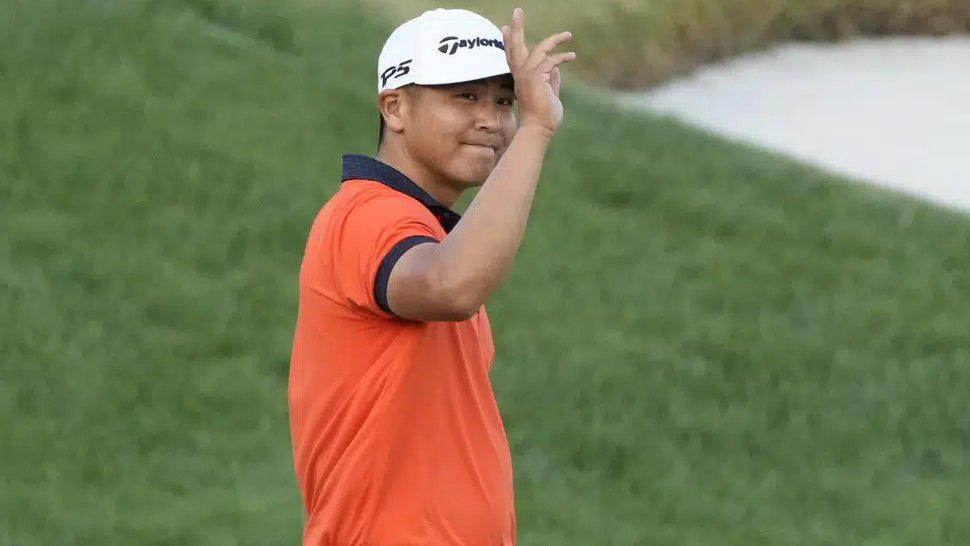 Kurt Kitayama waves to the gallery after sinking a birdie putt on the 18th hole during third round of the Arnold Palmer Invitational golf tournament Saturday, March 4, 2023, in Orlando, Fla. (AP Photo/John Raoux)