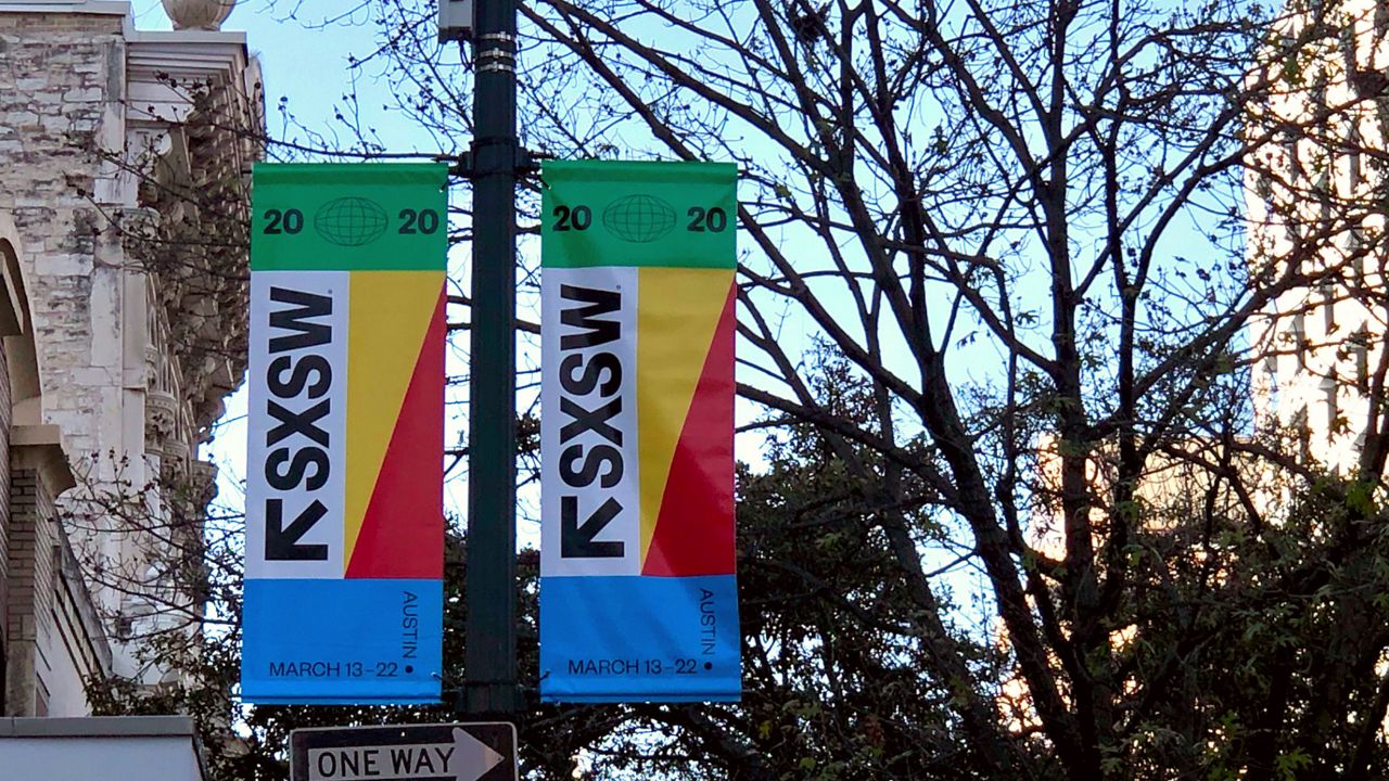 Two SXSW banners hang from a street pole in Downtown Austin. (Spectrum News/File)