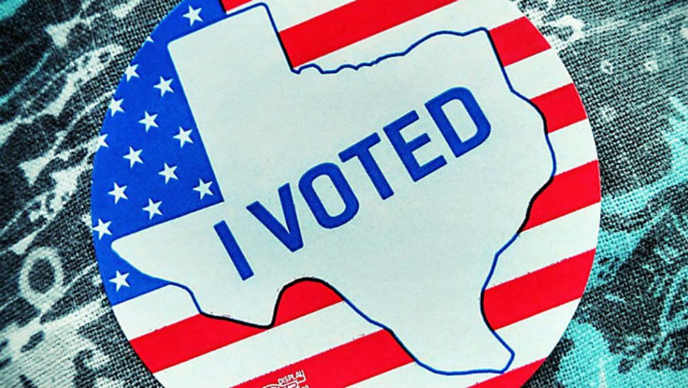An "I Voted" sticker in the shape of Texas. 