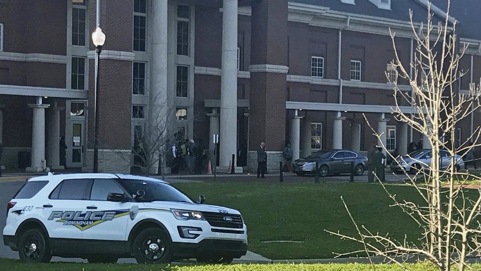 Authorities investigate the scene where a shooting occurred at Huffman High School, Wednesday, March 7, 2018, in Birmingham, Ala. 