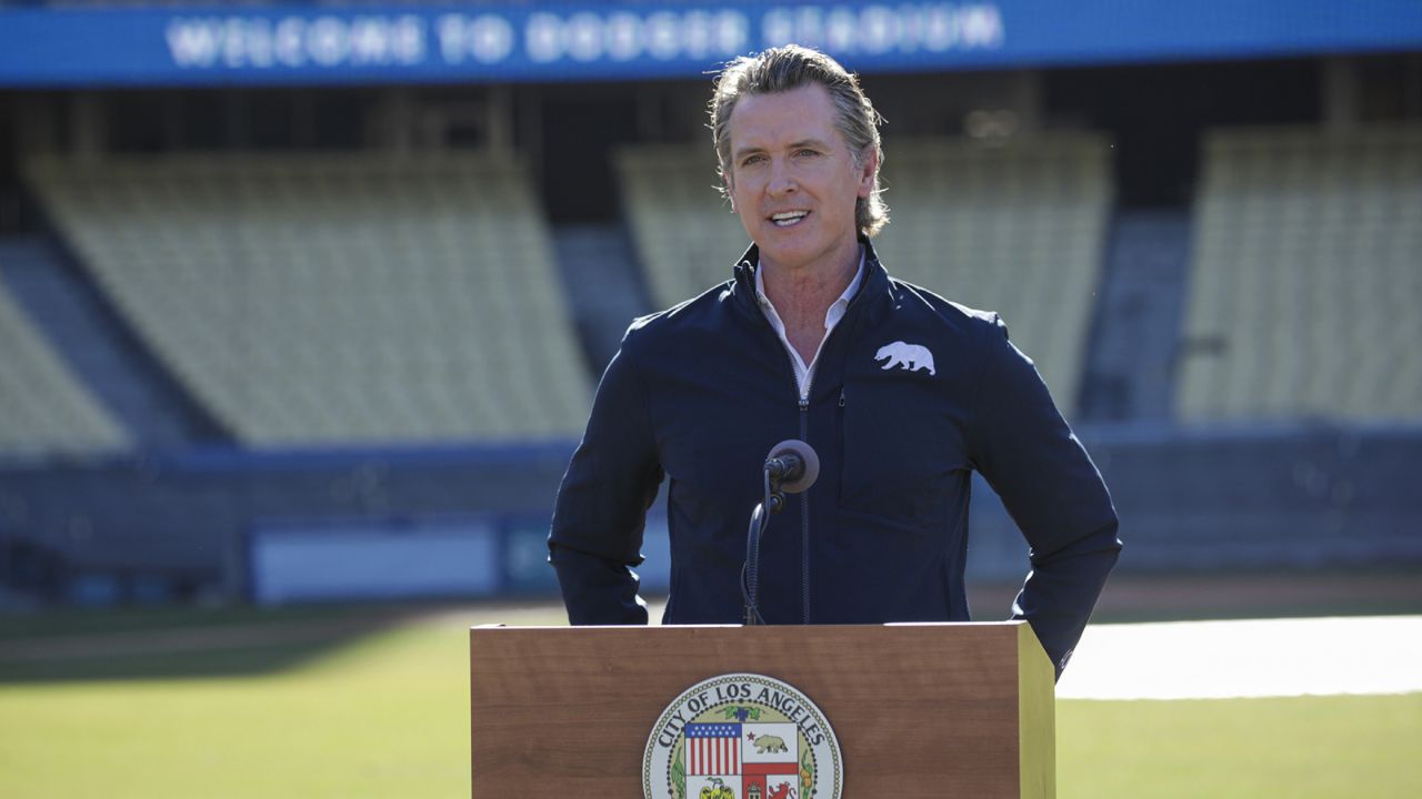 Governor Gavin Newsom addresses a press conference held at the launch of a mass COVID-19 vaccination site at Dodger Stadium, Friday, Jan. 15, 2021, in Los Angeles. (Irfan Khan/Los Angeles Times via AP, Pool)