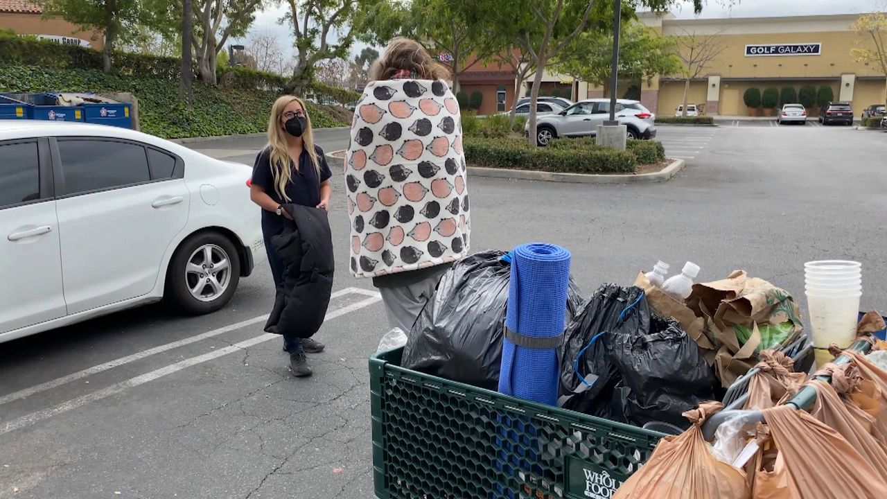 Christine Hodinh delivers coats made for freezing temperatures to the homeless. 