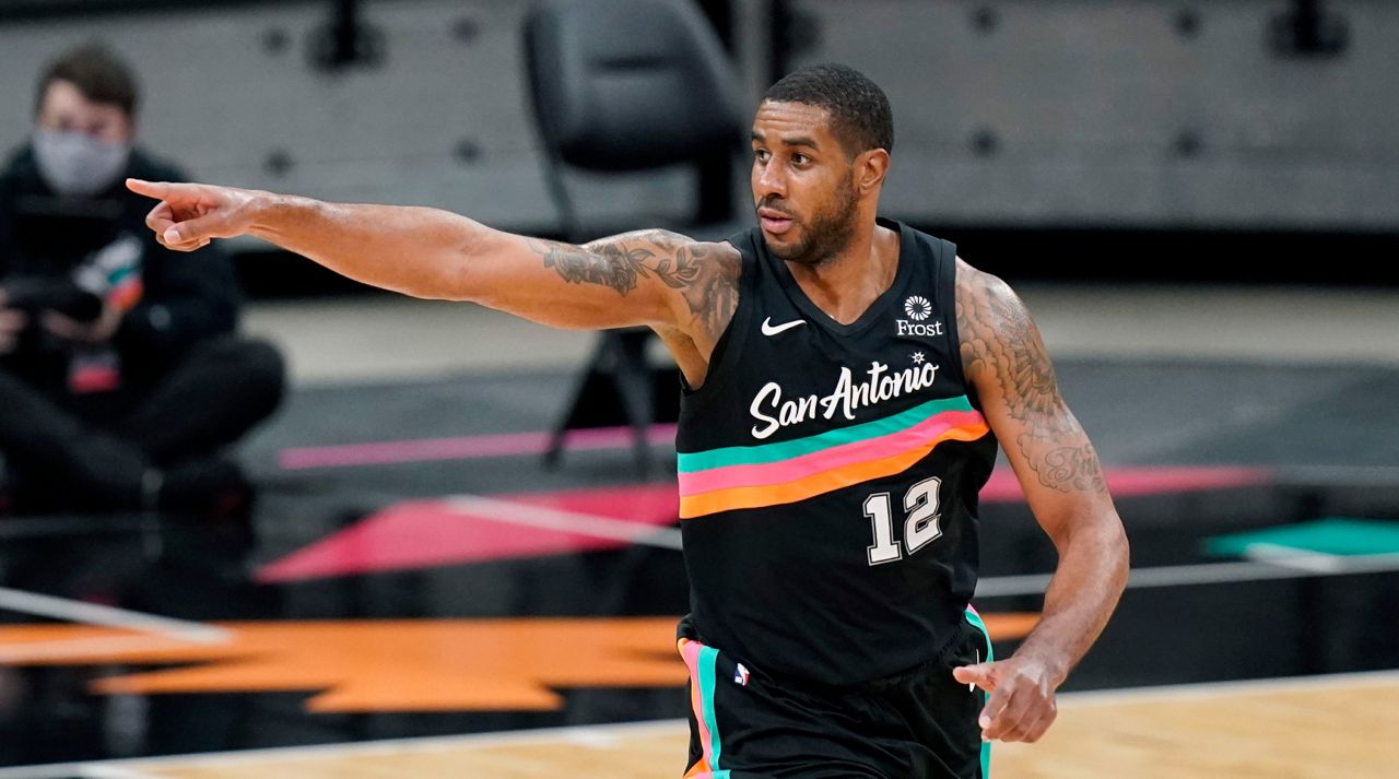 San Antonio Spurs center LaMarcus Aldridge points to a teammate after scoring against the Dallas Mavericks during the second half of an NBA basketball game in San Antonio, Friday, Jan. 22, 2021. (AP Photo/Eric Gay)