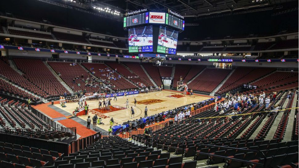 Omaha Skutt takes on Norris during the first day of the Nebraska boys state high school basketball tournament at Pinnacle Bank Arena Thursday, March 12, 2020, in Lincoln, Neb. The fans were restricted to staff and immediate family members due to concerns over the coronavirus. (Chris Machian/Omaha World-Herald via AP)