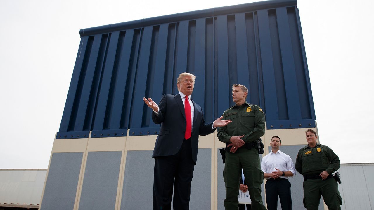 Trump near border wall prototype