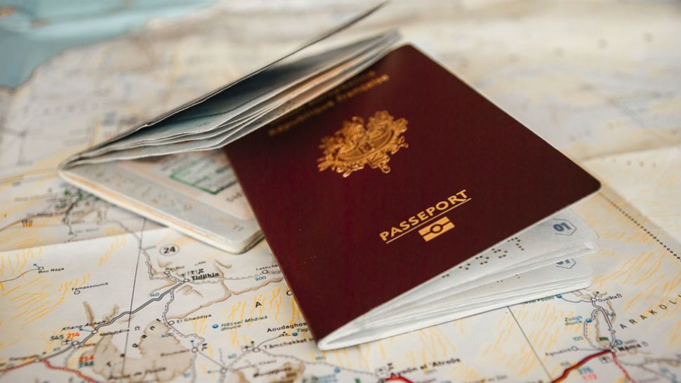 File photo of a passport and a map. 