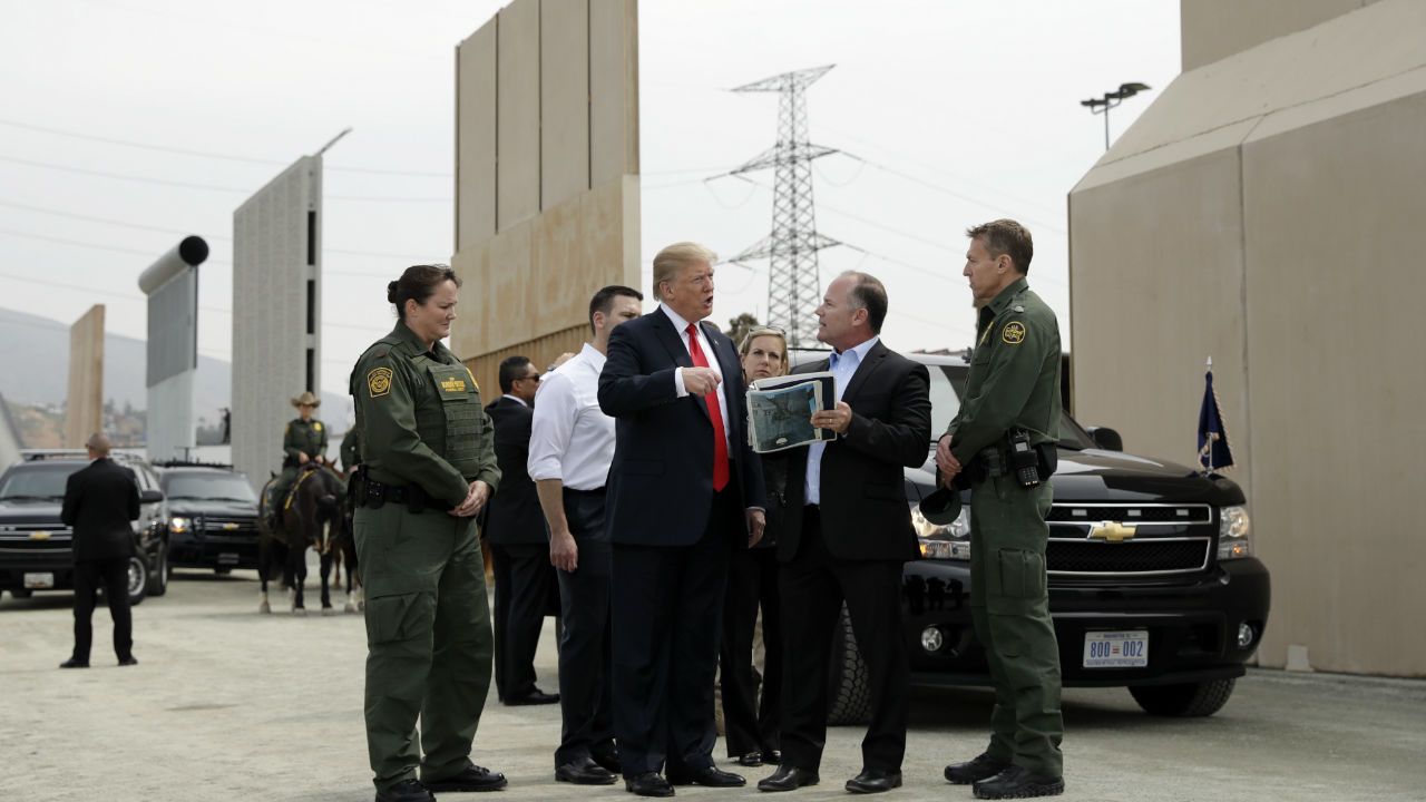President Trump looks at border wall prototypes