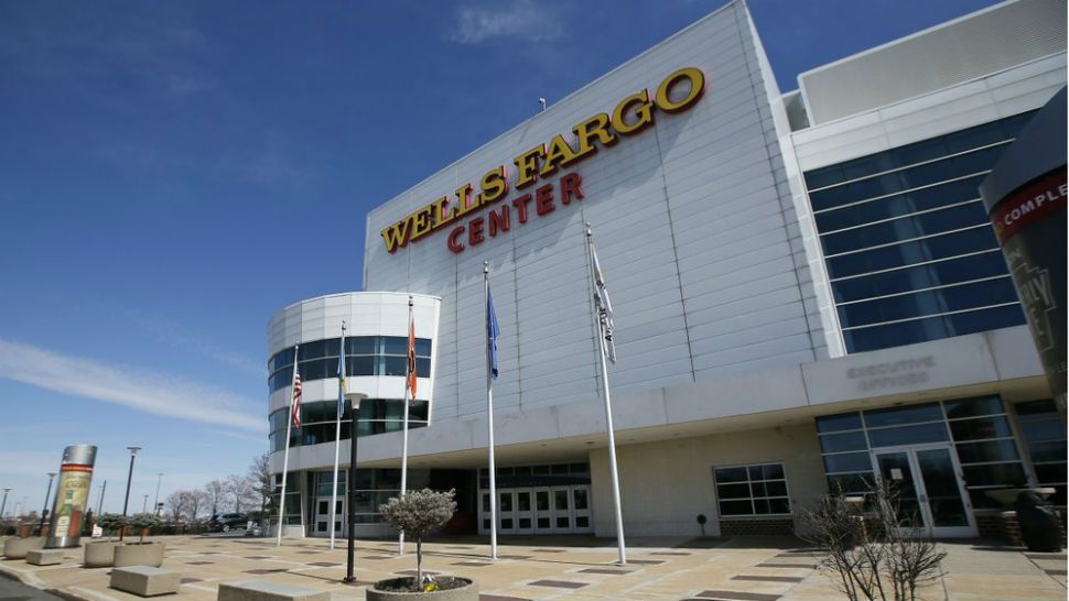 The Wells Fargo Center, home of the Philadelphia Flyers NHL hockey team and the Philadelphia 76ers NBA basketball team, is seen nearly empty, Saturday, March 14, 2020, in Philadelphia. All games at the Center have been postponed due to the COVID-19 pandemic. (AP Photo/Matt Slocum)