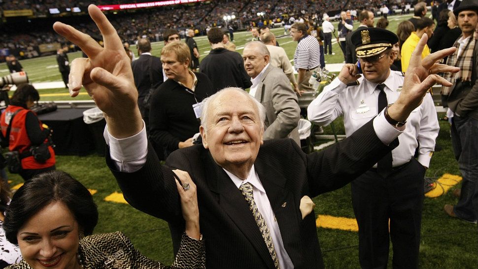 This Dec. 19, 2009, file photo shows New Orleans Saints owner Tom Benson walking on the field before the NFL football game against the Dallas Cowboys in New Orleans. (AP Photo/Dave Martin, File)
