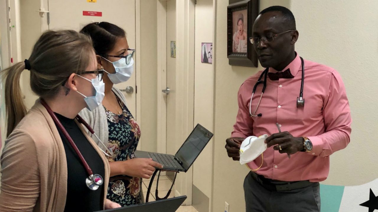 Dr. Dacelin St Martin talks to clinic staff. (Josh Rojas/Spectrum Bay News 9)