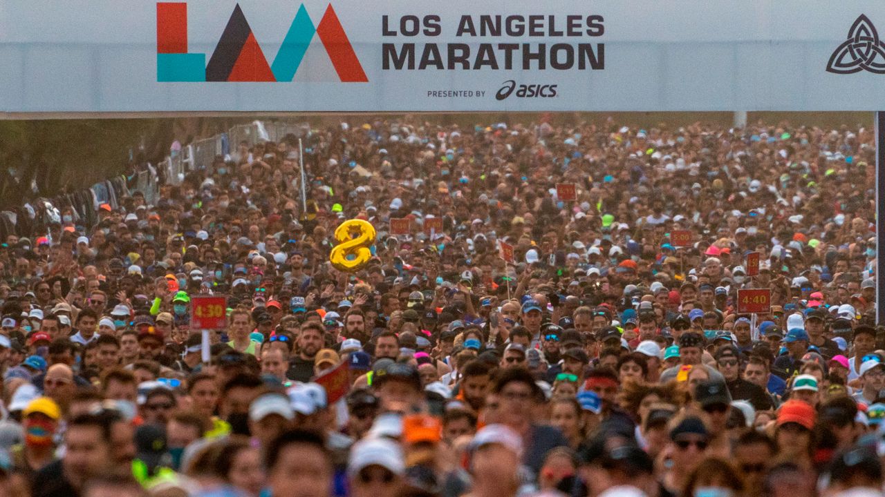 Runners start the Los Angeles Marathon in Los Angeles, Sunday, Nov. 7, 2021. (AP Photo/Damian Dovarganes)