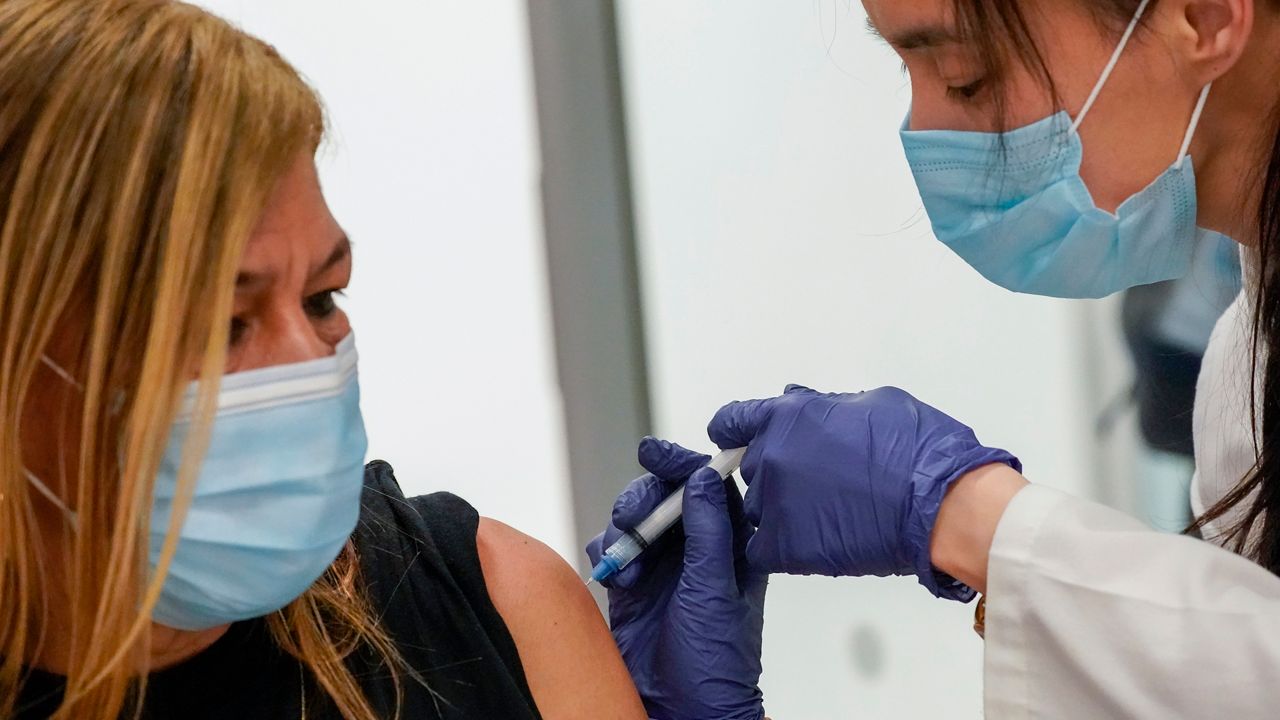 A patient receives a COVID-19 vaccine injection in this file image. (Associated Press)