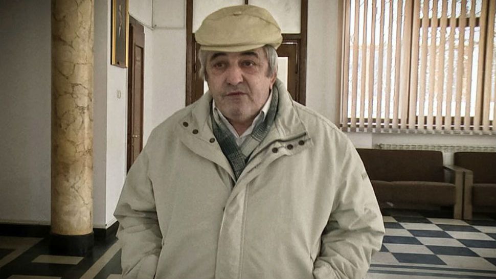 In this Wednesday, March 14, 2018 photograph Constantin Reliu speaks to media, outside a courtroom, in Vaslui, northern Romania. A Romanian court has rejected a man's claim that he's alive, after he was officially registered as deceased, according tot a court spokeswoman who said that the 63-year-old man has lost his case because he appealed too late. "I am a living ghost," he said venting his frustration against local authorities and his wife who he says unlawfully took ownership of a property after he was declared dead. (Simona Voicu/Adevarul via AP)