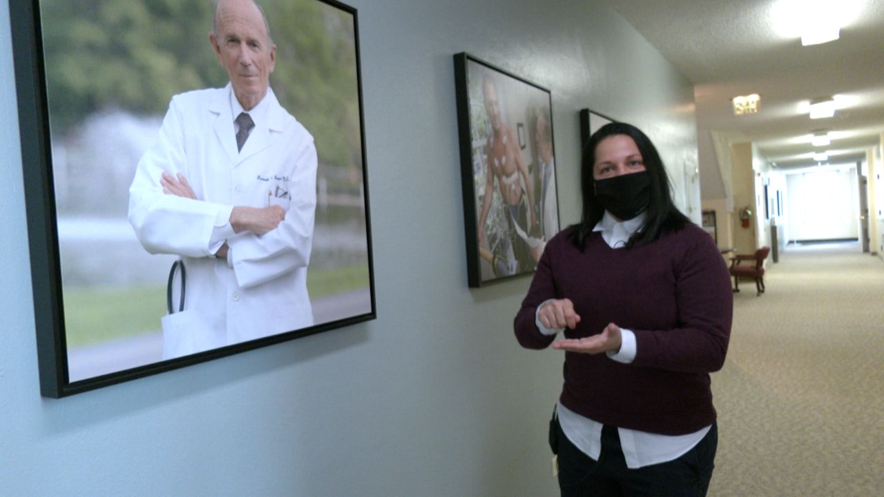 Director of Youth Research at the Cooper Institute Andjelka Pavlovic stands in a hallway at the Cooper Institute. (Spectrum News 1)