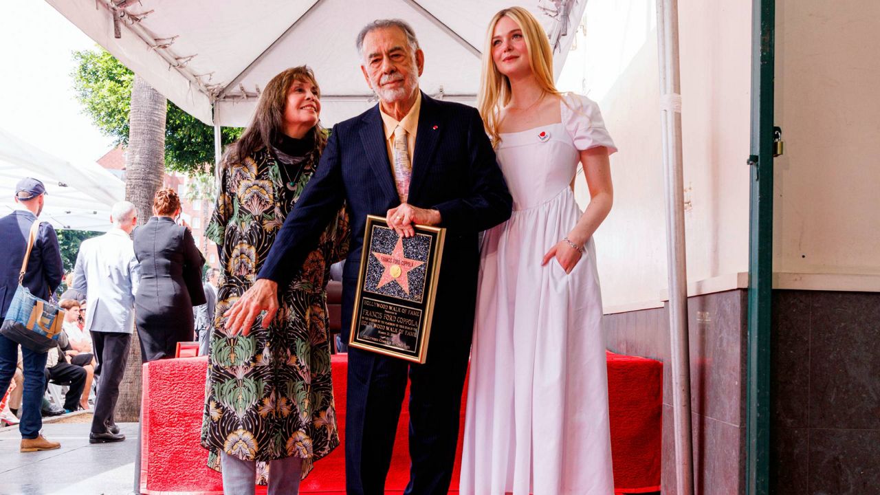 Talia Shire, from left, Francis Ford Coppola and Elle Fanning pose with a star miniature following a ceremony honoring Director Francis Ford Coppola with a star on the Hollywood Walk of Fame on Monday in Los Angeles. (Photo by Willy Sanjuan/Invision/AP)