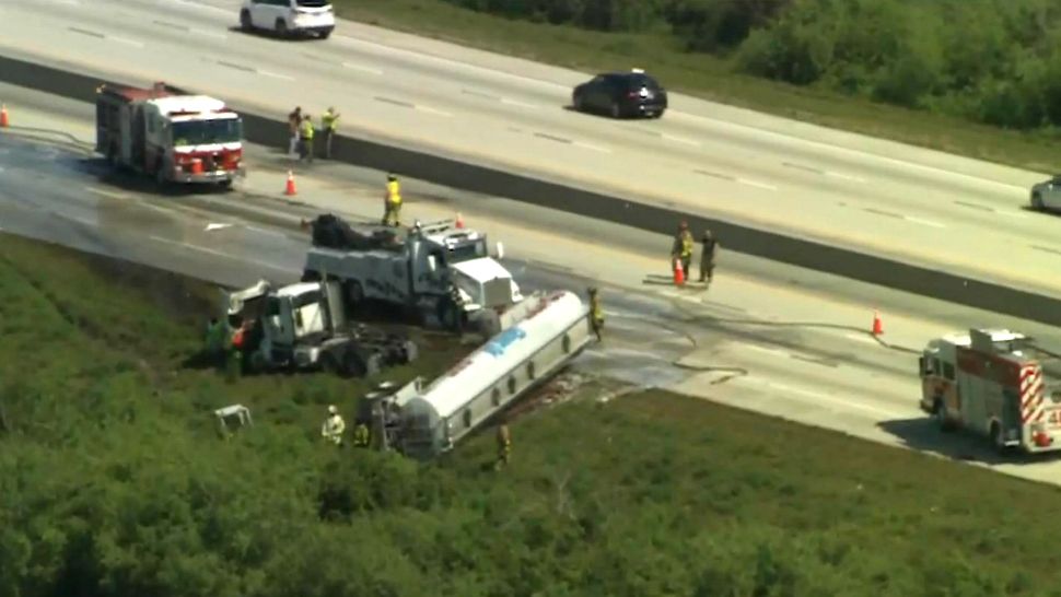 Firefighters and crews clean up biodiesel that spilled in a tanker-truck crash on Interstate 95 on Thursday morning. The fuel was flammable but not explosive. (Sky 13)