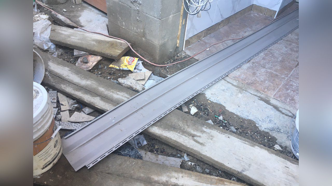 DOB Piece of Siding Falls Off Queens Building, Hits Woman