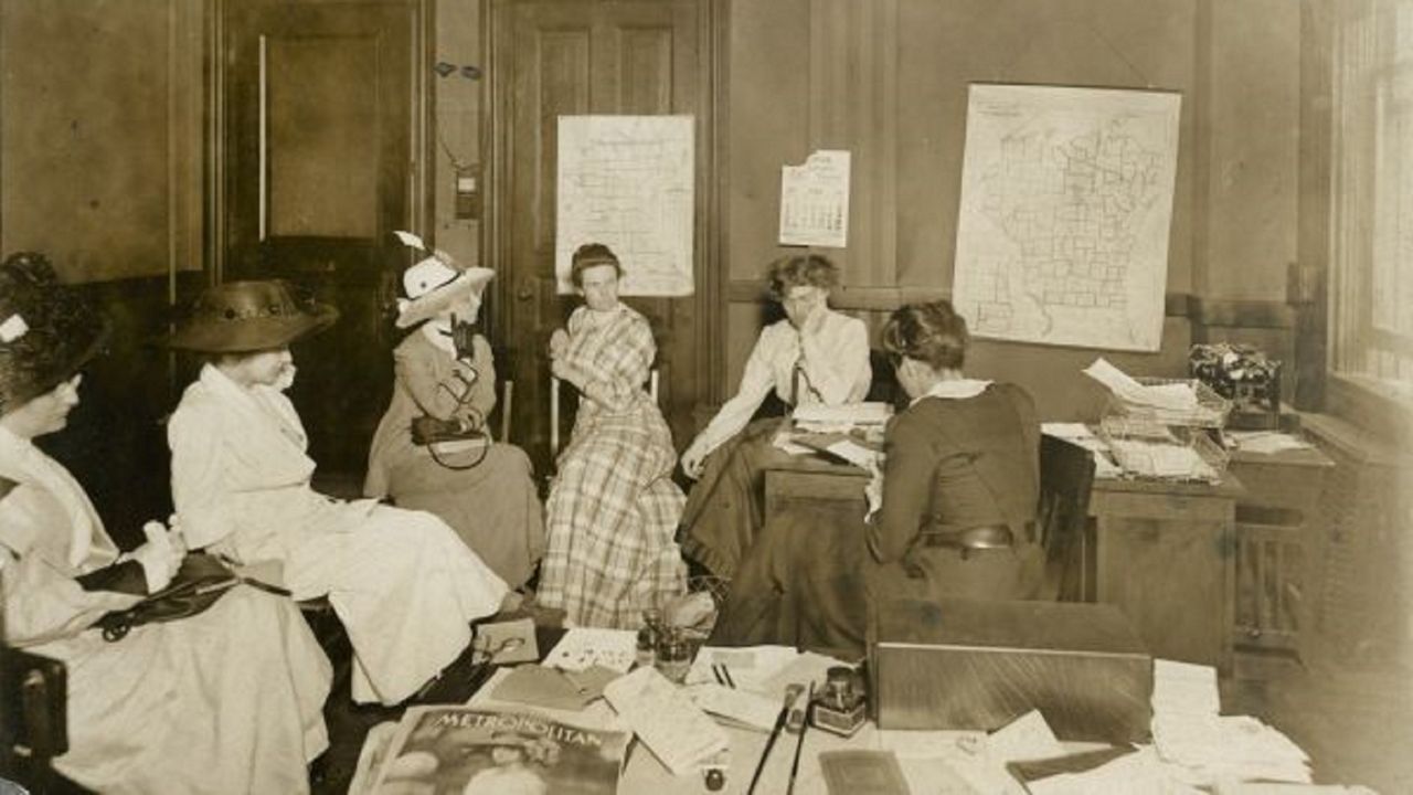 Women's rights leaders gather at suffrage headquarters in 1918