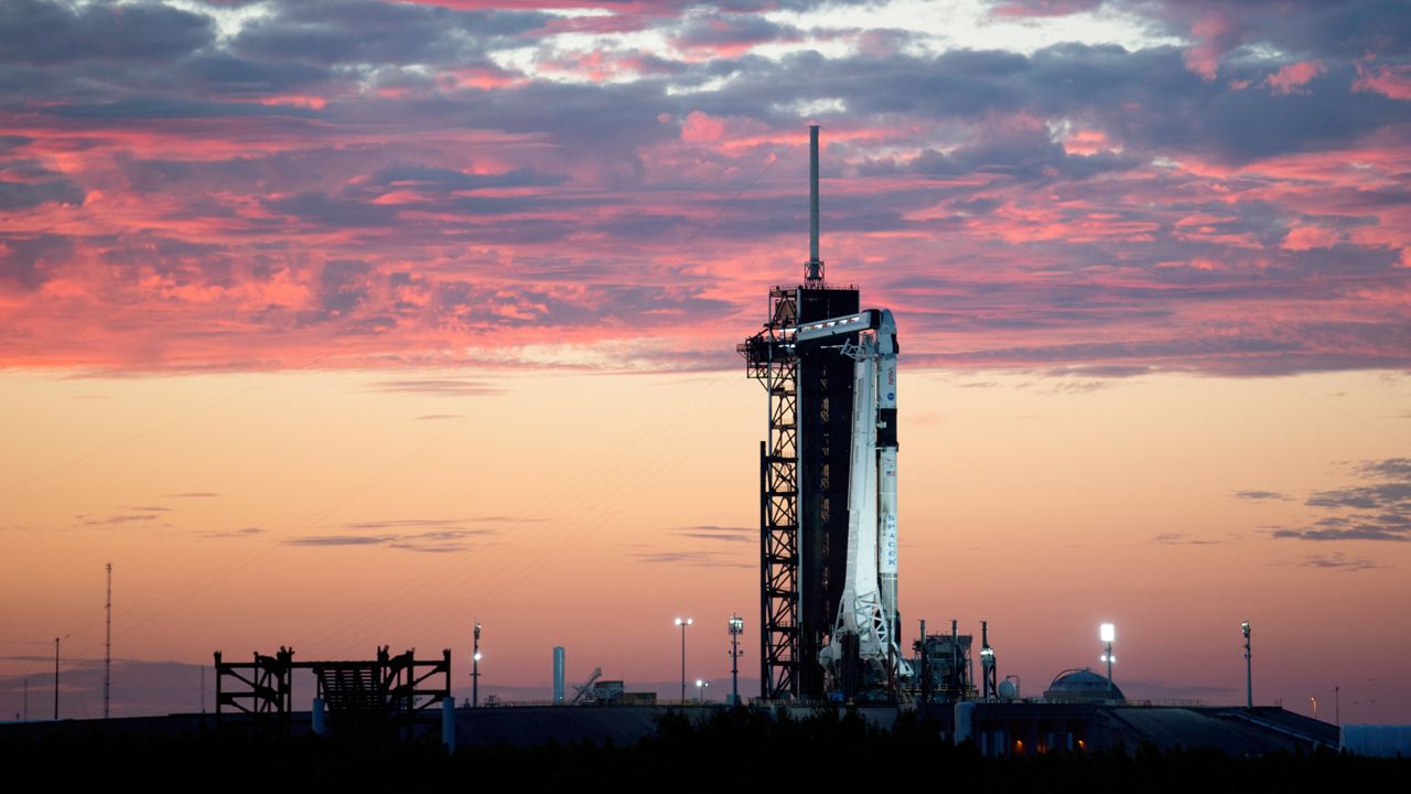 In this image released by NASA, a SpaceX Falcon 9 rocket with the company's Crew Dragon spacecraft onboard stands upright at sunset on the launch pad at Launch Complex 39A as preparations continue for the Crew-3 mission, Wednesday, Oct. 27, 2021, at the Kennedy Space Center in Cape Canaveral, Fla. (Joel Kowsky/NASA via AP)