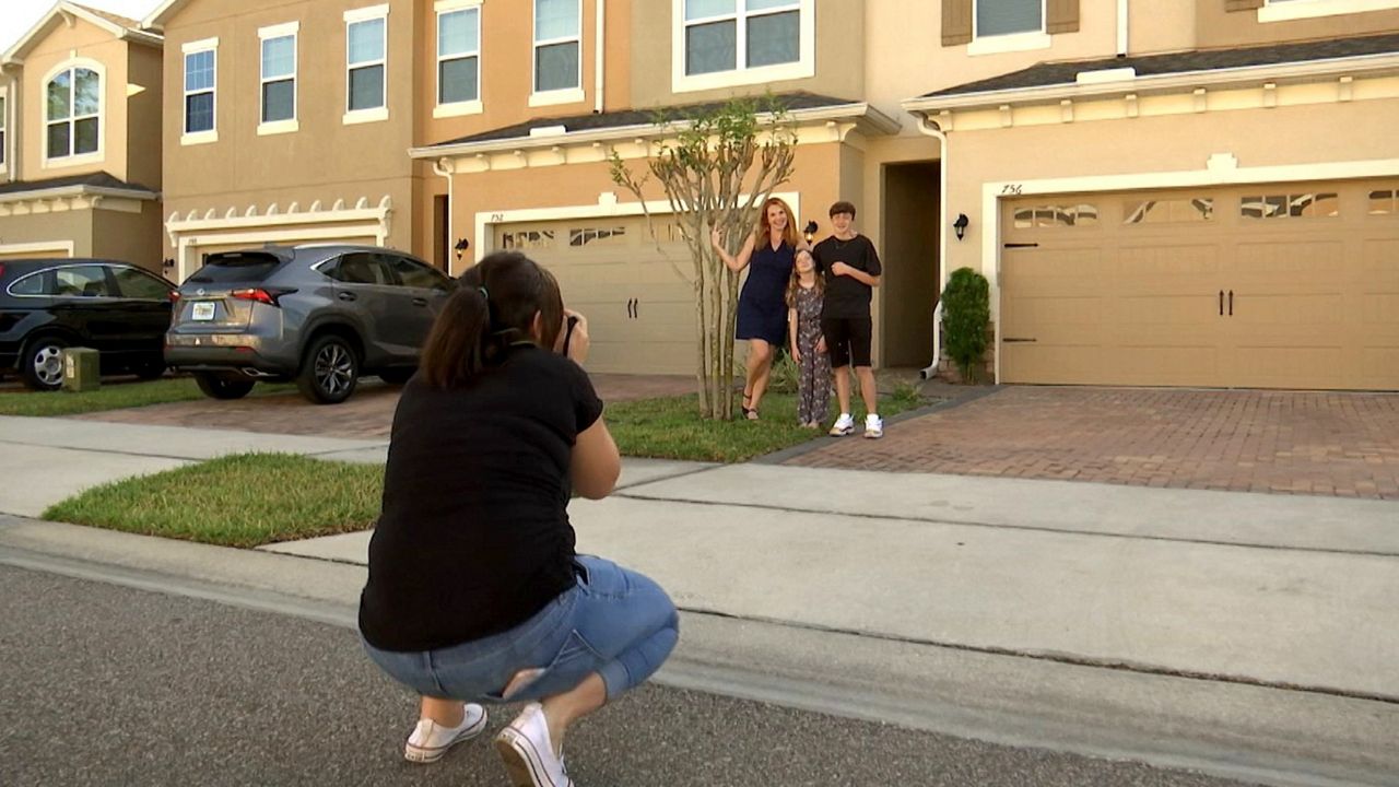 One Central Florida photographer is working to bring families together while documenting this unusual period of time, joining in a national movement called ‘The Front Steps Project.” (Rachael Krause/Spectrum News 13)