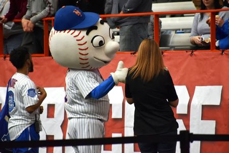 A New York Mets fan gives the thumbs-up as Met and New York