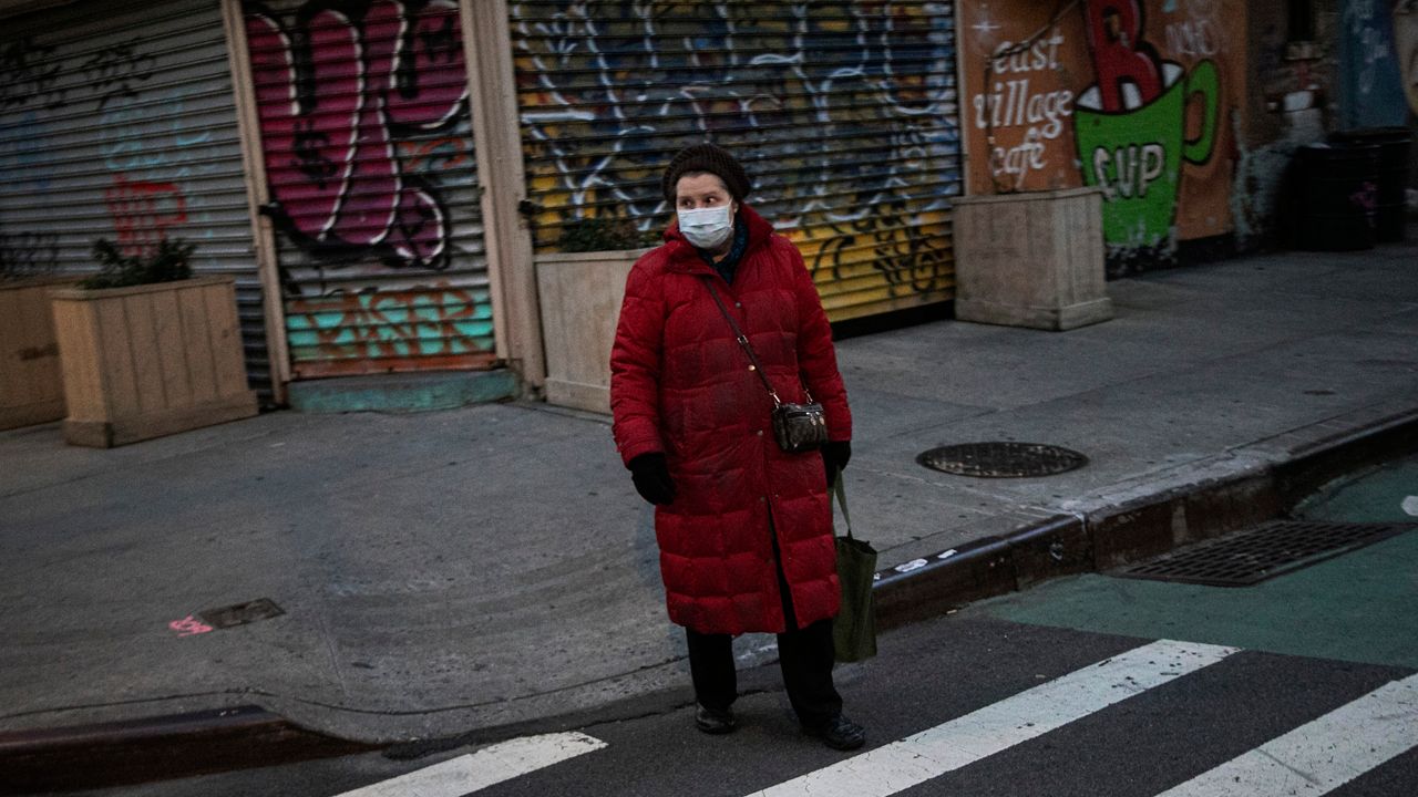 A woman wearing a face mask in the East Village.