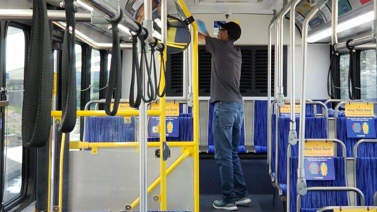 Photo of a worker cleaning a CapMetro bus (photo credit: CapMetro)
