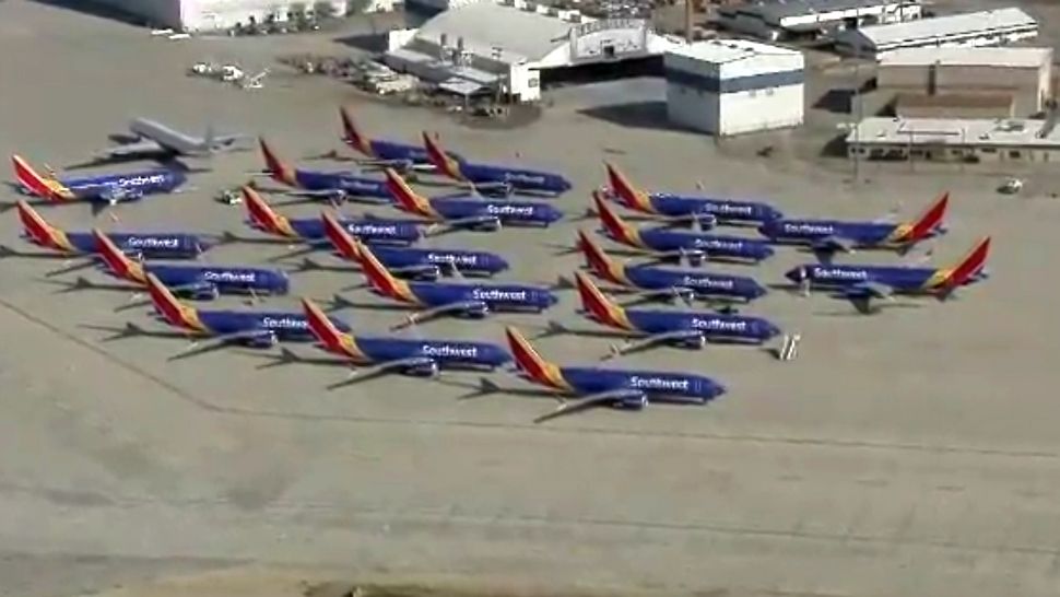 Southwest Boeing 737 Max 8 planes sit idle in storage at Southern California Logistics Airport in Victorville, California, in this undated aerial image. The popular Boeing jets have been grounded internationally amid an investigation into 2 deadly crashes overseas. (Screen capture of KCAL and KCBS video via CNN)