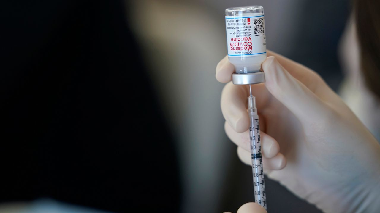 A syringe is filled with the Moderna vaccine. (AP Photo, File)