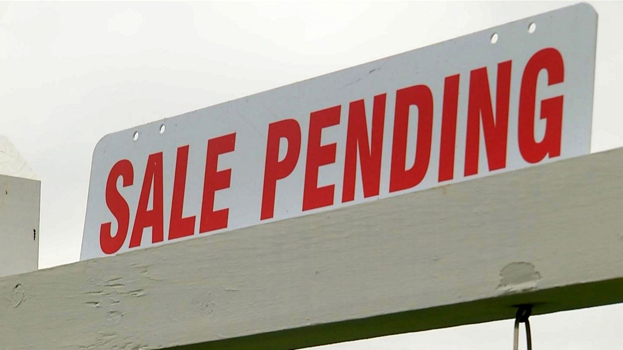 A "sale pending" sign appears outside a home in this file image. (Spectrum News/FILE)