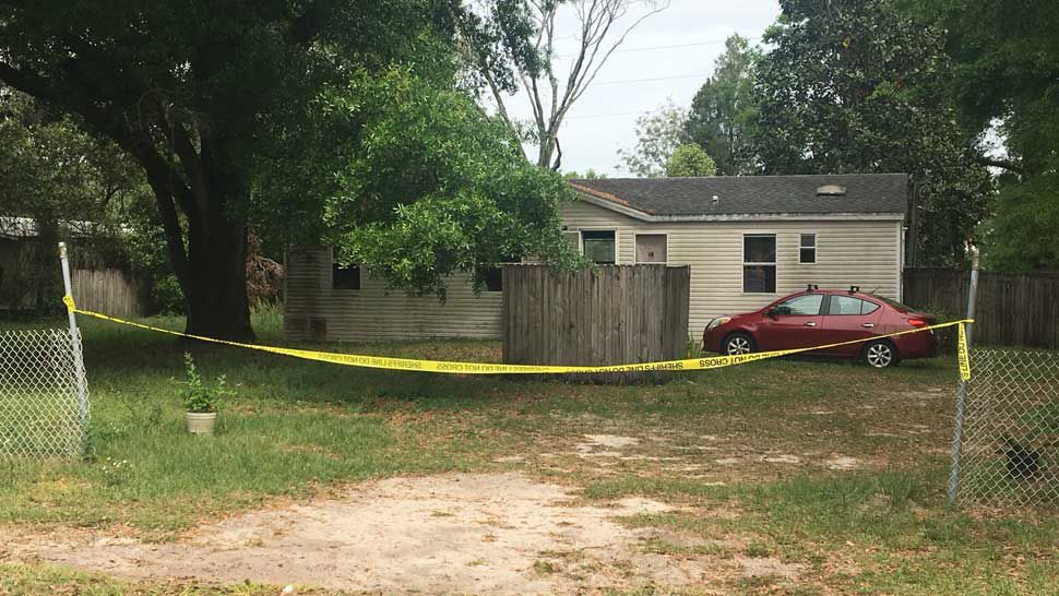 Crime scene tape blocking the entrance to a home in Thonotosassa where a woman's body was found on Sunday, March 17, 2019. (Jorja Roman/Spectrum Bay News 9)