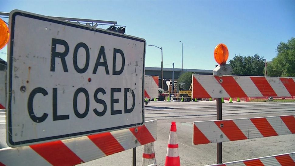 Road closure sign and barricades (Spectrum News/File)