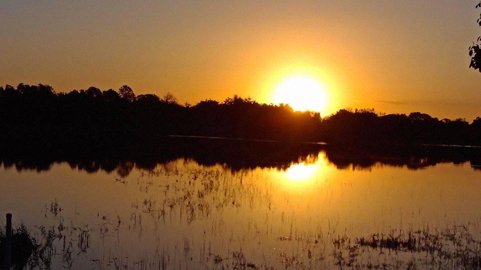 Submitted via the Spectrum News 13 app: The sun really paints the skies over Louise Lake in Deltona on Saturday, April 20, 2019. (Courtesy of viewer Naree Van Zanen)