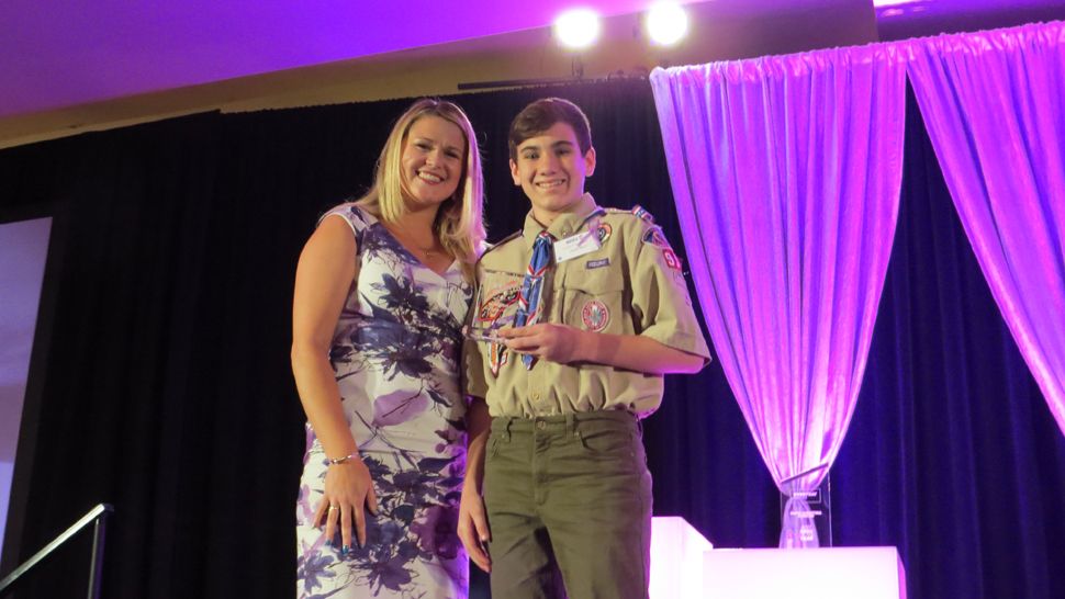 The Everyday Viewers' Choice Hero of the Year Elijah Kelly poses with co-hostess Erin Murray. (Anthony Leone, staff)                     