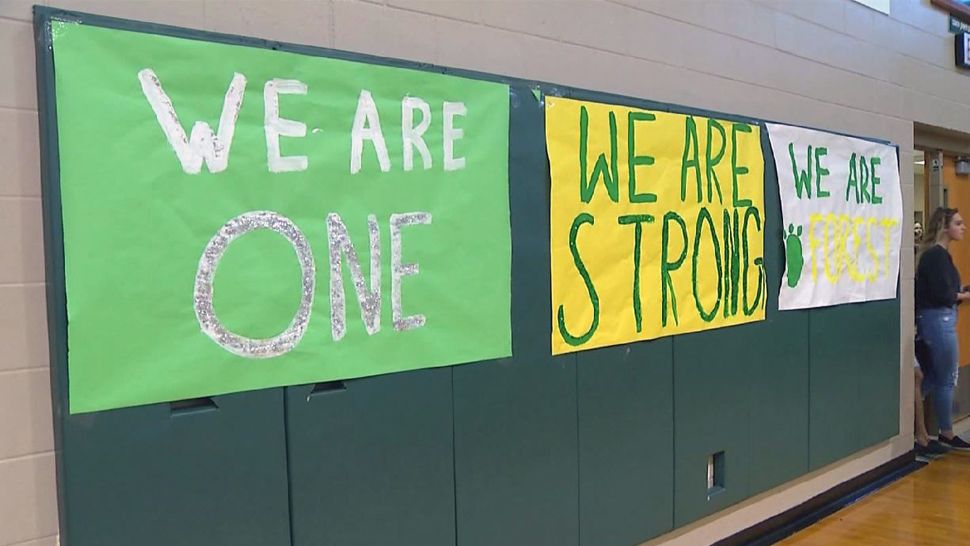The hashtag #ForestStrong was posted on a fence outside Forest High School in Ocala on Friday. Students were asking people to wear green in support of the school, which was the site of a shooting a week ago. (Spectrum News 13)