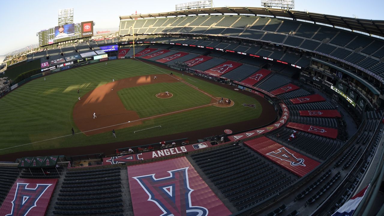 An overall view of Angel Stadium of Anaheim during the third inning of a baseball game between the Los Angeles Angels and Seattle Mariners in Anaheim, Calif., Tuesday, July 28, 2020. (AP Photo/Kelvin Kuo)