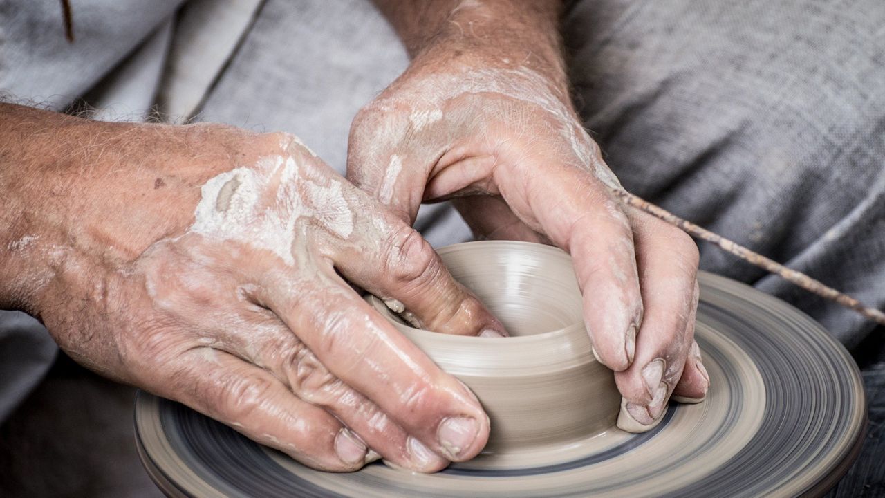 Photo of a person making pottery (Pixabay)