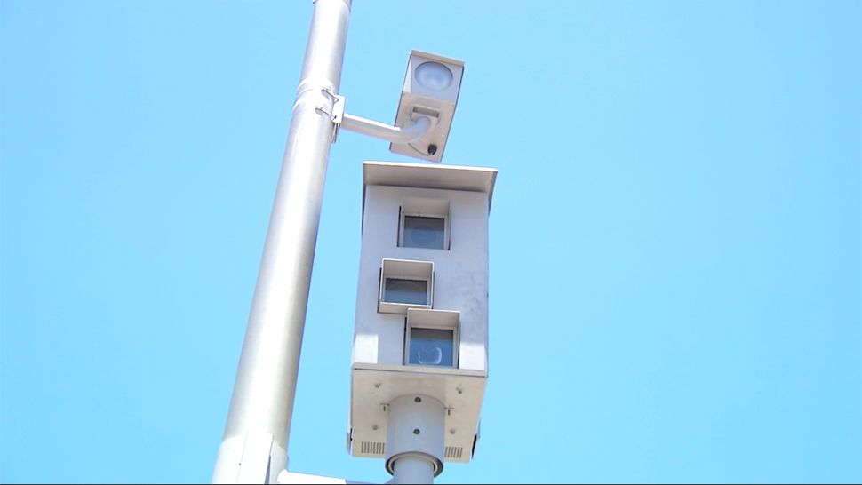 A red light camera at an intersection. (File)