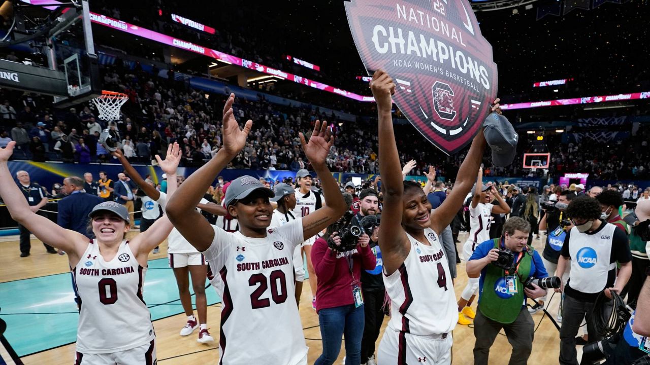 South Carolina players celebrate after a college basketball game in the final round of the Women's Final Four NCAA tournament against UConn Sunday in Minneapolis. (AP Photo/Eric Gay)