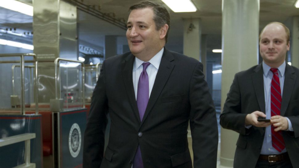 Sen. Ted Cruz, R-Texas walks to the senate chamber, Friday, Feb. 9, 2018, at Capitol Hill in Washington. (AP Photo/Jose Luis Magana)