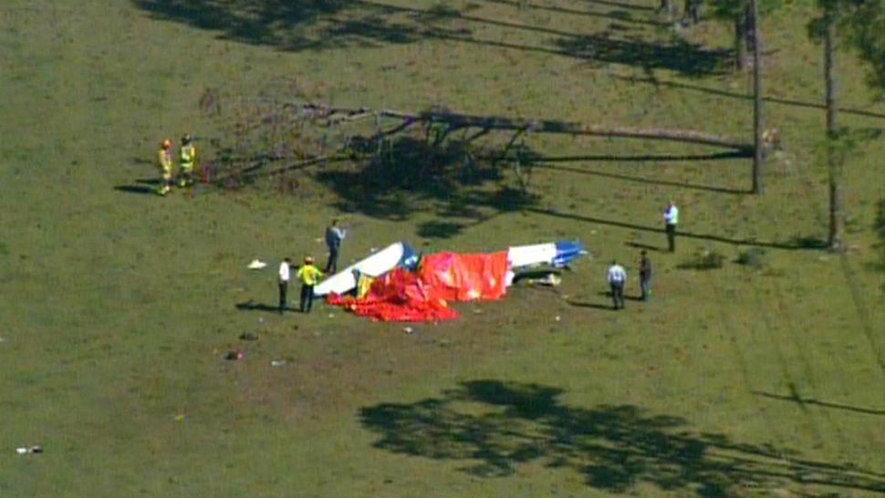 Volusia County Sheriff's deputies and firefighters investigate the scene of a small plane crash Wednesday morning, April 4, 2018. The plane had just taken off from Daytona Beach International Airport. (Sky 13)