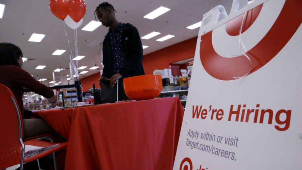 Photo of a "hiring" sign inside a Target store (AP Images)