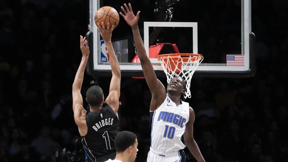 Brooklyn Nets forward Mikal Bridges (1) goes to the basket against Orlando Magic center Bol Bol (10) during the first half of an NBA basketball game Friday, April 7, 2023, in New York. (AP Photo/Mary Altaffer)