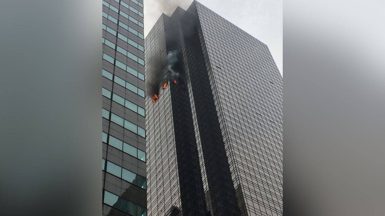 Smoke rising from a skyscraper.