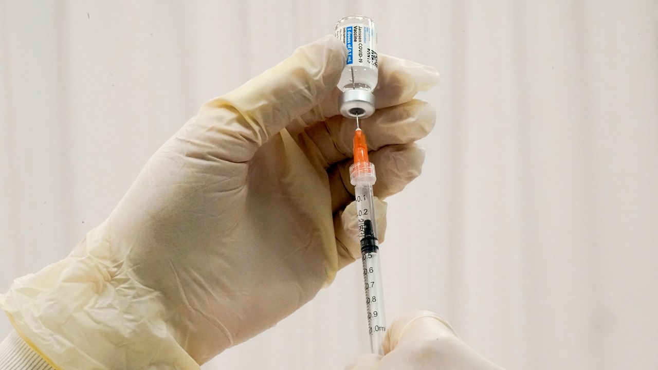 A COVID-19 vaccine injection is prepared in this file image. (Associated Press)