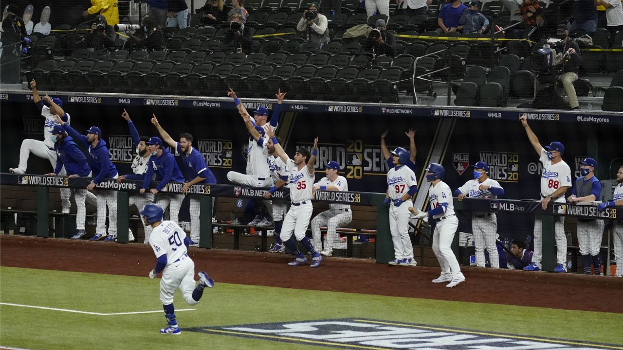 Los Angeles Dodgers' Mookie Betts celebrates after a home run against the Tampa Bay Rays during the eighth inning in Game 6 of the baseball World Series Tuesday, Oct. 27, 2020, in Arlington, Texas. (AP Photo/Tony Gutierrez)