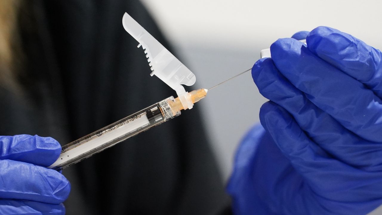 Needle with COVID-19 vaccine. (File)